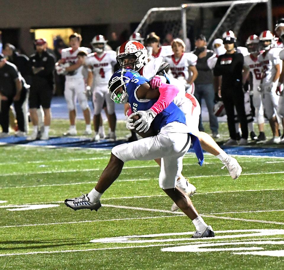 Tre'Mar Harris (5) makes a clutch catch for Winton Woods setting them up in the red zone with only seconds remaining in the game at Winton Woods Stadium, Oct. 6, 2023.