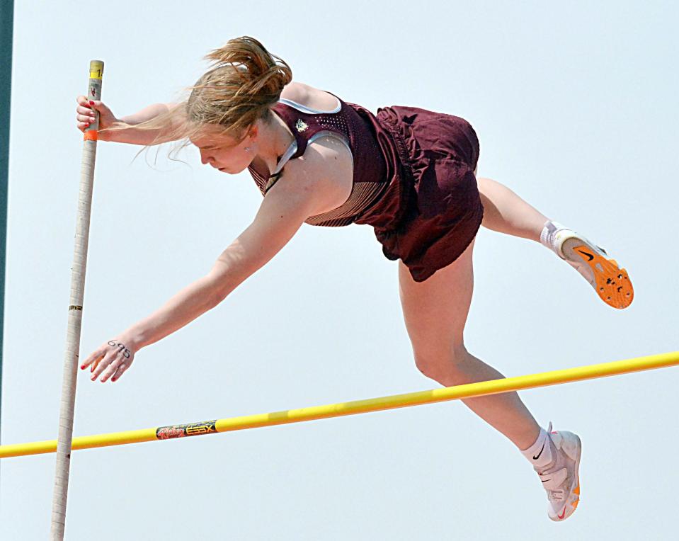 Milbank's Jacy Dexter attempts to clear the bar in the girls' pole vault during the Pat Gilligan Alumni track and field meet on Tuesday, April 25, 2023 in Estelline.