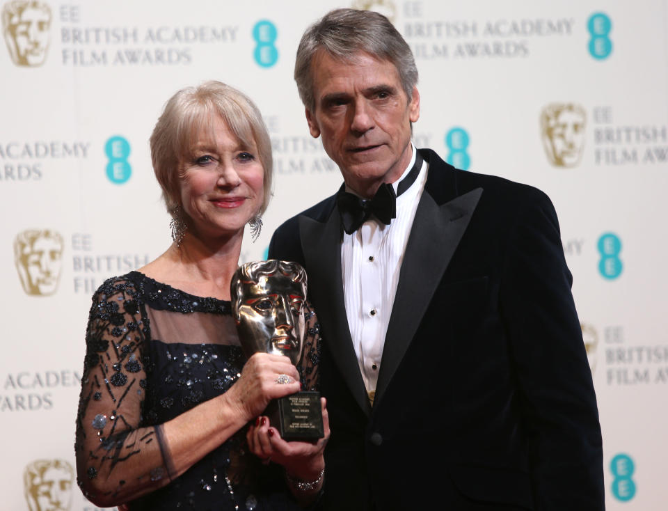Dame Helen Mirren winner of outstanding contribution and Jeremy Irons poses for photographers in the winners room at the EE British Academy Film Awards held at the Royal Opera House on Sunday Feb. 16, 2014, in London. (Photo by Joel Ryan/Invision/AP)