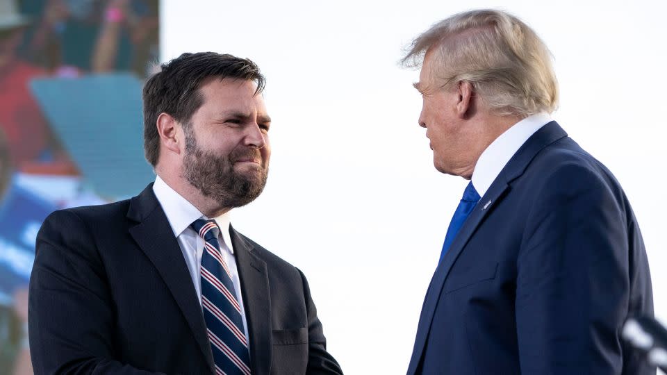 In this April 2022 photo, J.D. Vance, shakes hands with former President Donald Trump during a rally hosted by the former president at the Delaware County Fairgrounds in Delaware, Ohio. - Drew Angerer/Getty Images