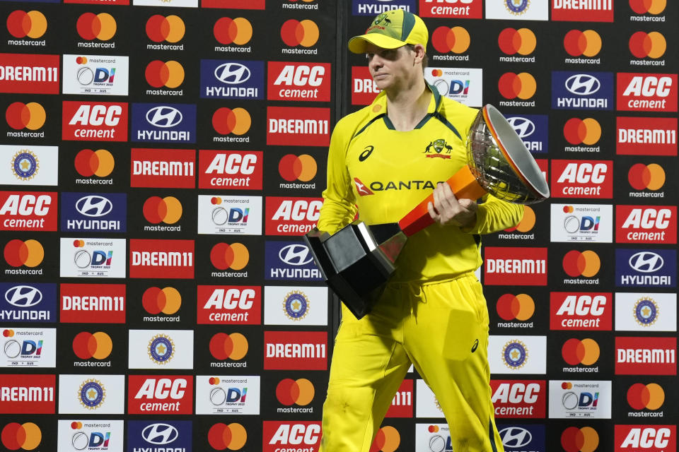 Australia's captain Steven Smith walks with the winners trophy after their win in the third and last one day international cricket match against India in Chennai, India, Wednesday, March 22, 2023. Australia won the series 2-1. (AP Photo/Aijaz Rahi)
