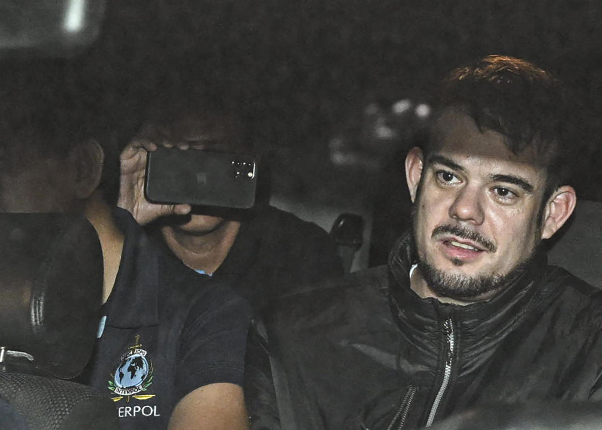 Dutch national Joran Van der Sloot is transferred in a police car from the Ancon I jail in Lima, Peru, to be handed over temporarily to U.S. custody, June 8, 2023. / Credit: ERNESTO BENAVIDES/AFP/Getty