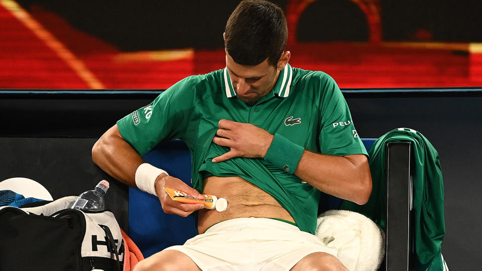 Novak Djokovic was troubled by an abdominal injury during his victory over Taylor Fritz at the Australian Open. (Photo by Quinn Rooney/Getty Images)