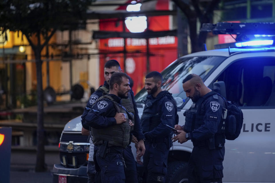 Israeli police inspect the site of a shooting attack in Tel Aviv, Israel, Saturday, Aug 5, 2023. Israeli authorities said Saturday that a Palestinian gunman opened fire in central Tel Aviv, critically wounding one person who was transferred to the hospital. The gunman was shot and received medical treatment for his wounds. (AP Photo/Maya Alleruzzo)