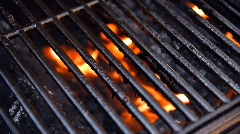 grill grates on top of charcoal fire