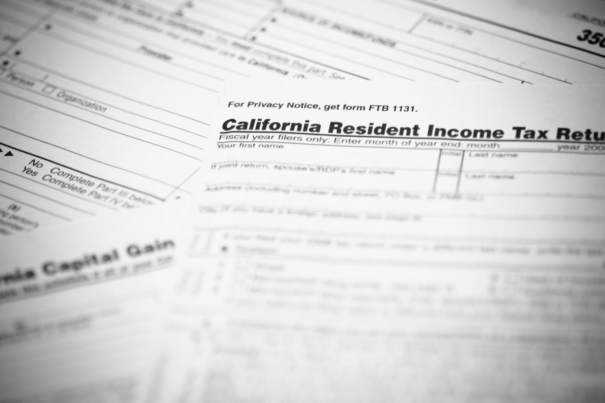 California income tax form 540 with supplemental forms in the background