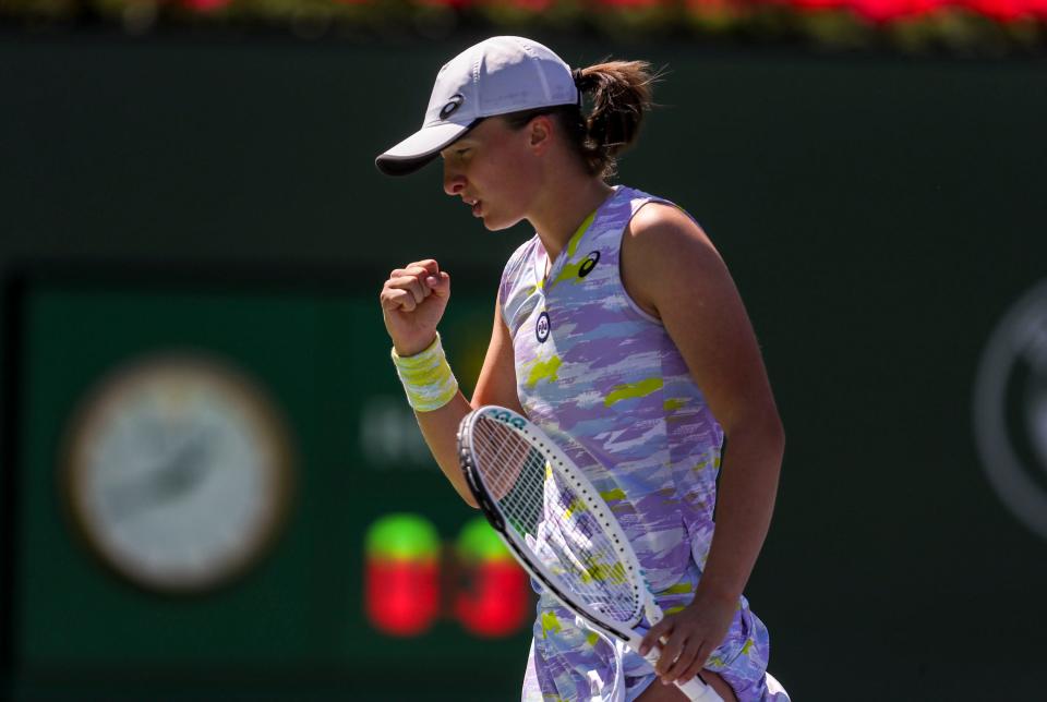 Iga Swiatek of Poland celebrates a point against Maria Sakkari of Greece during the WTA singles final at the BNP Paribas Open at the Indian Wells Tennis Garden in Indian Wells, Calif., Sunday, March 20, 2022. 