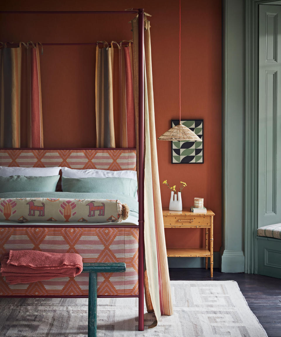 Use rich, warm tones for cozy bedroom ideas that envelop