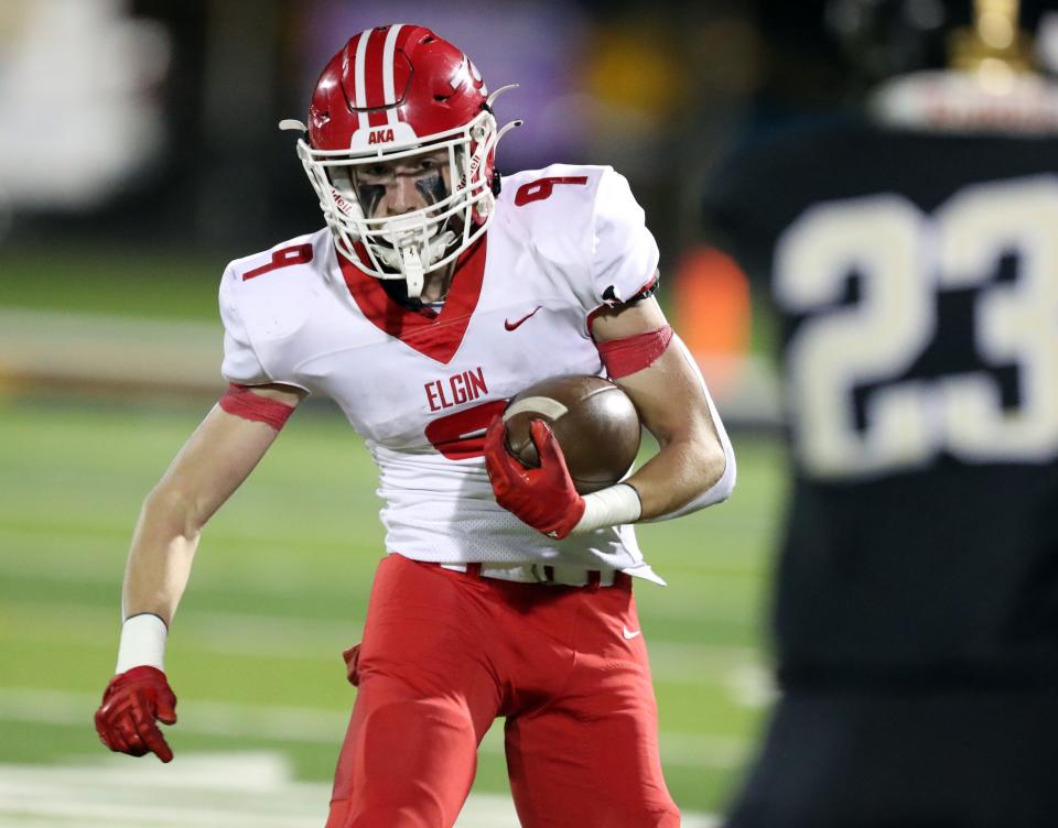 Matthew Lund carries as the Midwest City Bombers play the Elgin Owls on Nov 3, 2023; Midwest City, Oklahoma, United States; at Midwest City High School. Mandatory Credit: Steve Sisney-The Oklahoman