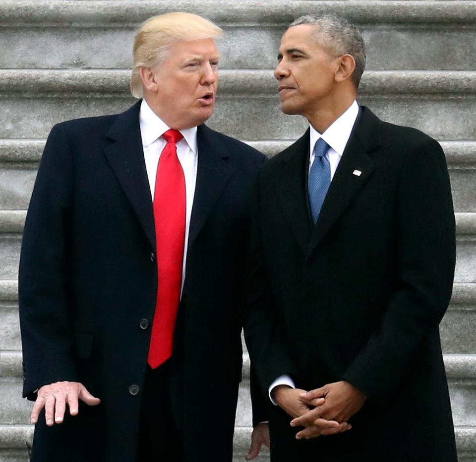 President Donald Trump talks with former President Barack Obama on Capitol Hill in Washington, prior to Obama's departure to Andrews Air Force Base, Maryland on Jan. 20, 2017.