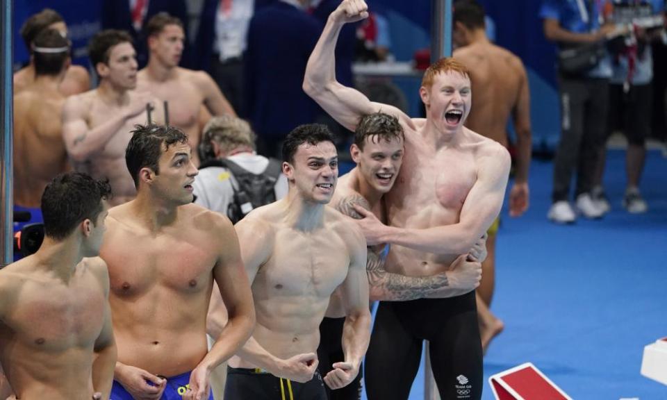 Team GB men celebrate their 4x200m relay gold