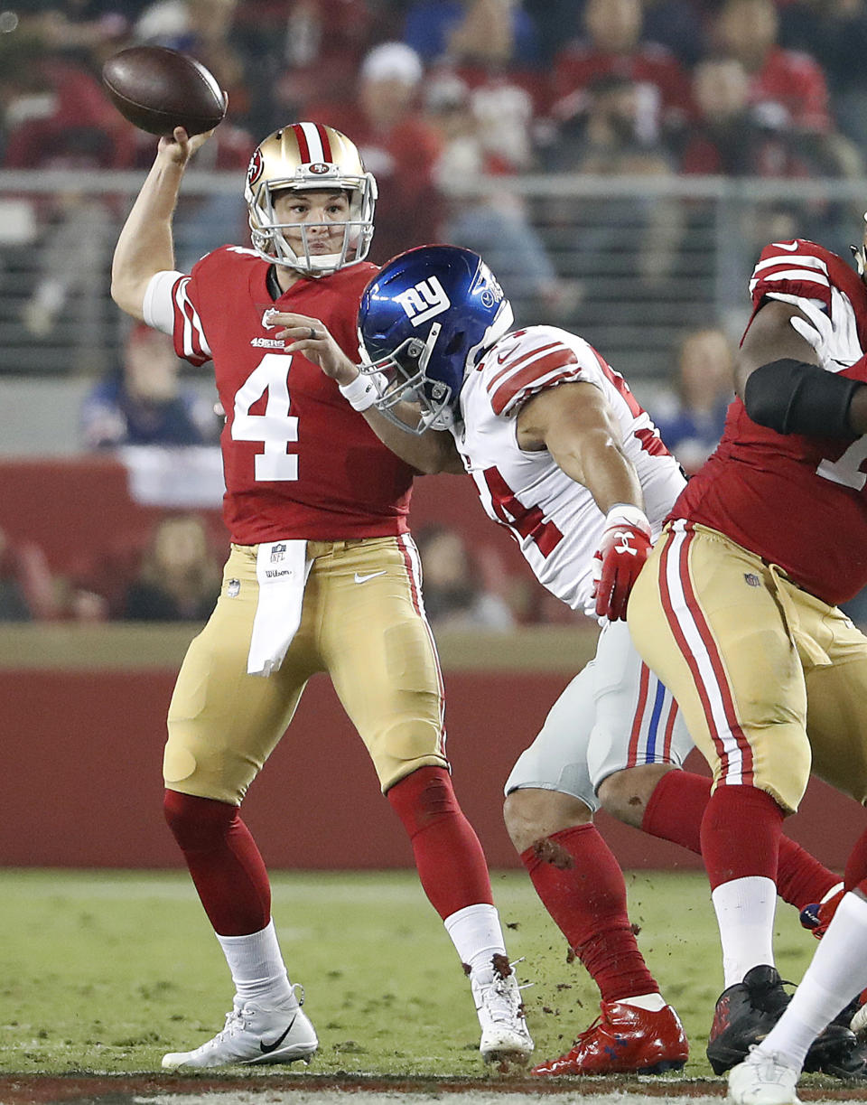 San Francisco 49ers quarterback Nick Mullens (4) passes against the New York Giants during the first half of an NFL football game in Santa Clara, Calif., Monday, Nov. 12, 2018. (AP Photo/Tony Avelar)
