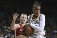 Baylor guard Juicy Landrum, right, pulls down a rebound over Texas Tech guard Sydney Goodson, left, in the first half of an NCAA college basketball game, Saturday, Jan. 25, 2020, in