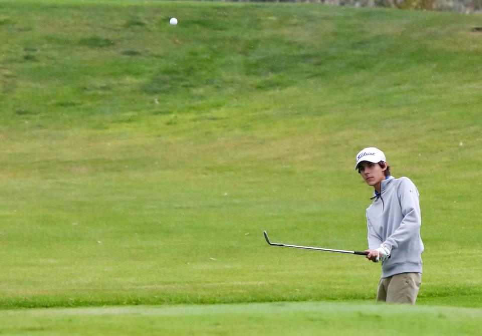 Kaleb Jost of Sioux Falls Christian chips onto the green Tuesday while playing in the second round of the Class A boys state golf tournament at Moccasin Creek Country Club in Aberdeen. Jost finished tied for fifth place.