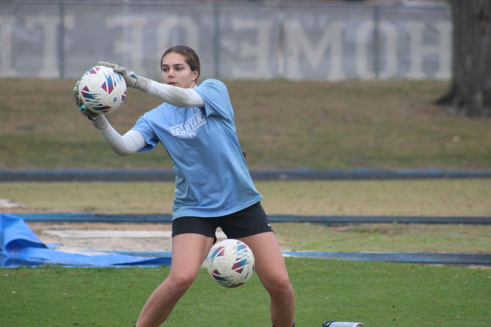 St. Johns Country Day goalkeeper Roxy Mathews saves shots during a high school girls soccer practice on Friday.