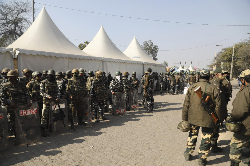 Paramilitary soldiers stand guard at Singhu, the Delhi-Haryana border camp for protesting farmers against three farm bills, in New Delhi, India, Wednesday, Jan. 27, 2021. Leaders of a protest movement sought Wednesday to distance themselves from a day of violence when thousands of farmers stormed India's historic Red Fort, the most dramatic moment in two months of demonstrations that have grown into a major challenge of Prime Minister Narendra Modi’s government. (AP Photo/Manish Swarup)