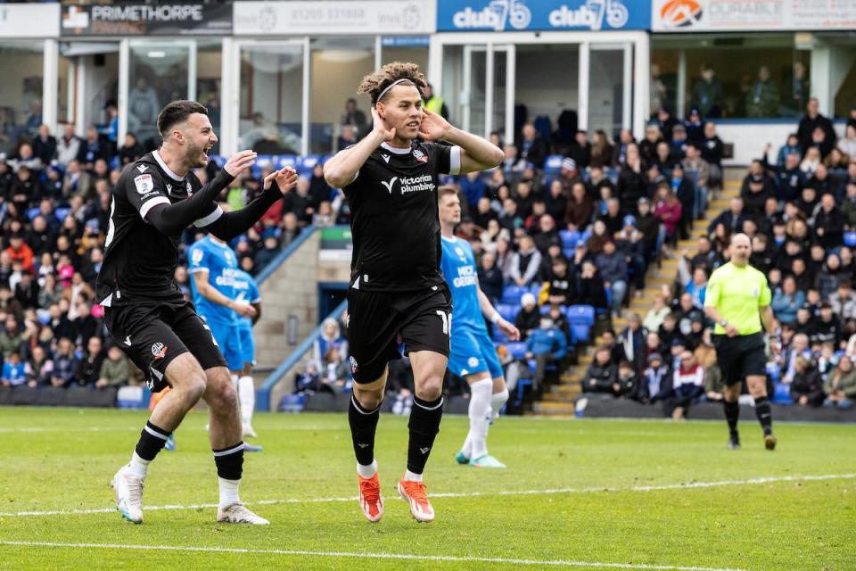 Dion Charles celebrates scoring his penalty in the first half at Peterborough <i>(Image: Camerasport)</i>