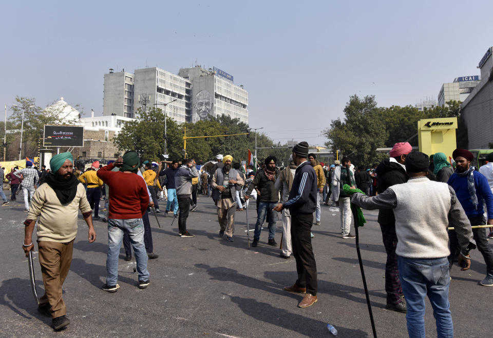 NEW DELHI, INDIA - JANUARY 26: Demonstrators in large numbers at ITO during the farmers' tractor rally on Republic Day, on January 26, 2021 in New Delhi, India. Major scenes of chaos and mayhem at Delhi borders as groups of farmers allegedly broke barricades and police check posts and entered the national capital before permitted timings. Police used tear gas at Delhi's Mukarba Chowk to bring the groups under control. Clashes were also reported at ITO, Akshardham. Several rounds of talks between the government and protesting farmers have failed to resolve the impasse over the three farm laws. The kisan bodies, which have been protesting in the national capital for almost two months, demanding the repeal of three contentious farm laws have remained firm on their decision to hold a tractor rally on the occasion of Republic Day.(Photo by Sanjeev Verma/Hindustan Times via Getty Images)