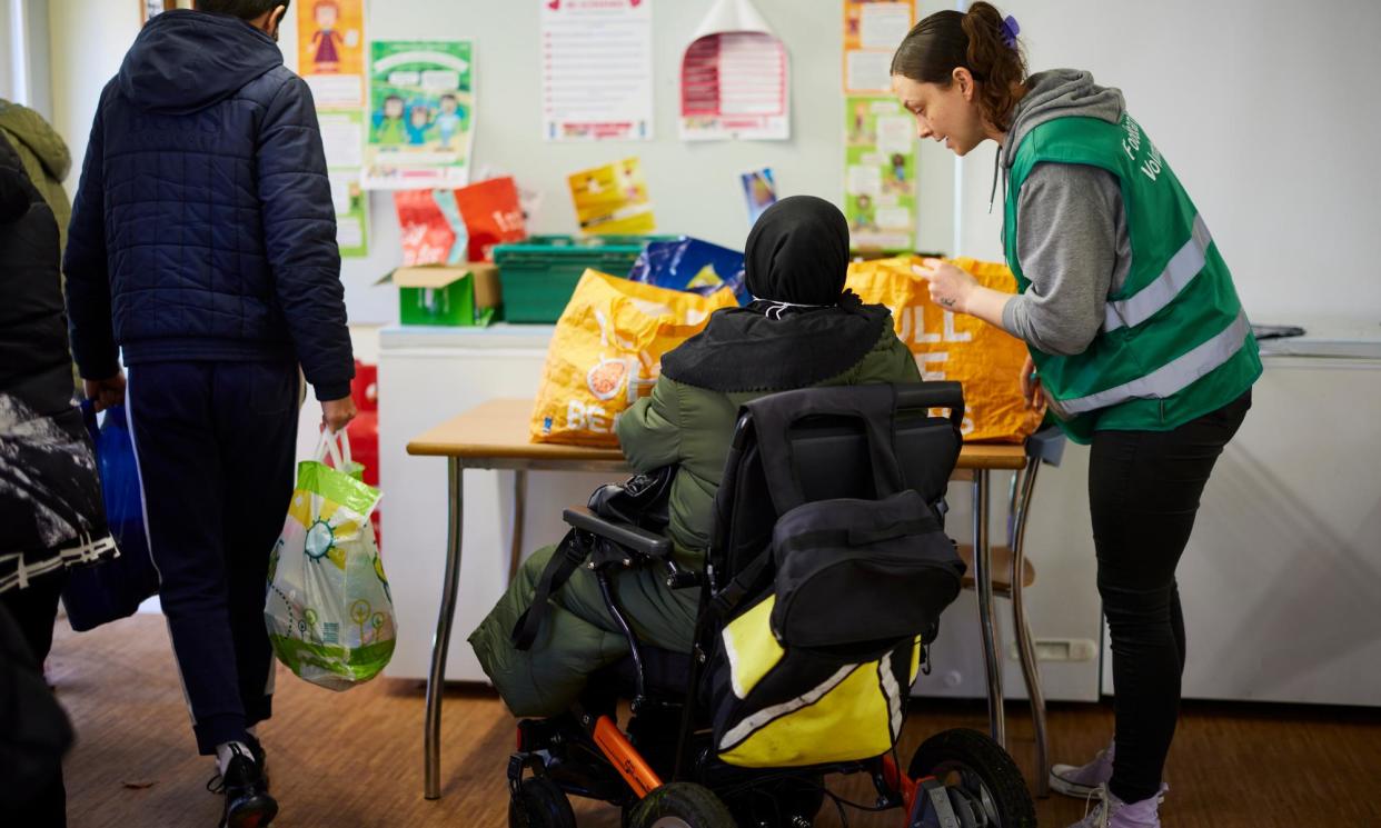 <span>One in 10 people in poverty relied on food banks throughout 2022-23, figures from the Department for Work and Pensions showed.</span><span>Photograph: Christopher Thomond/The Guardian</span>