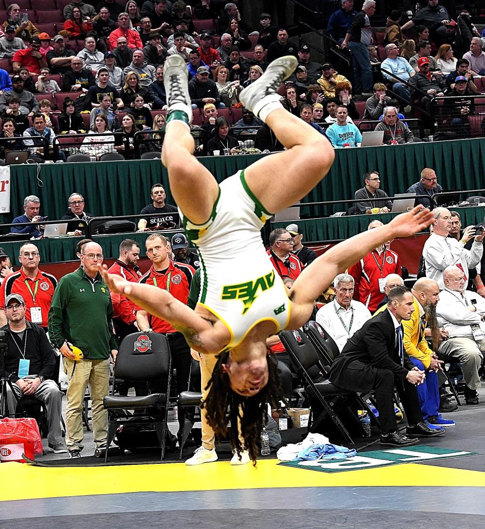 Sycamore's Eugene Harney flips for joy after winning the Division I 157-pound title match at the 2024 OHSAA Wrestling State Tournament, Columbus, Ohio, March 10, 2024.