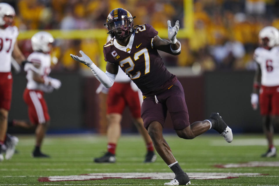 Minnesota defensive back Tyler Nubin (27) celebrates after intercepting a Nebraska pass during the first half of an NCAA college football game Thursday, Aug. 31, 2023, in Minneapolis. (AP Photo/Abbie Parr)