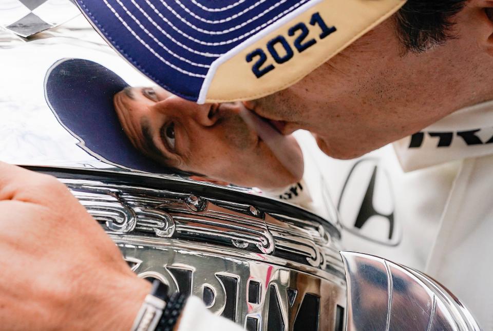 Meyer Shank Racing driver Helio Castroneves (6) poses for photos to celebrate winning the105th running of the Indianapolis 500, Monday, May 31, 2021, at Indianapolis Motor Speedway. This is the fourth Indianapolis 500 Castroneves has won. 