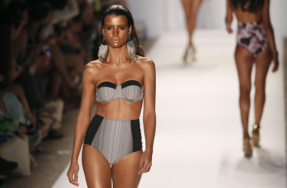 A model wears swimwear from the collection of L Space during the Mercedes-Benz Fashion Week Swim 2013 show, Sunday, July 22, 2012, in Miami Beach, Fla. (AP Photo/Lynne Sladky)