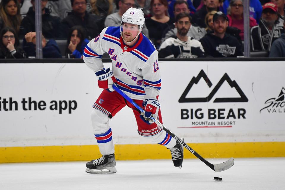 Jan 20, 2024; Los Angeles, California, USA; New York Rangers left wing Alexis Lafreniere (13) controls durng the third period at Crypto.com Arena.