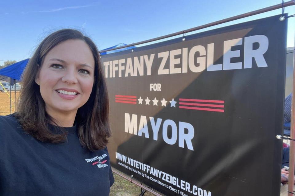Pembroke Mayor Tiffany Zeigler poses in front of her campaign sign during last year's election.