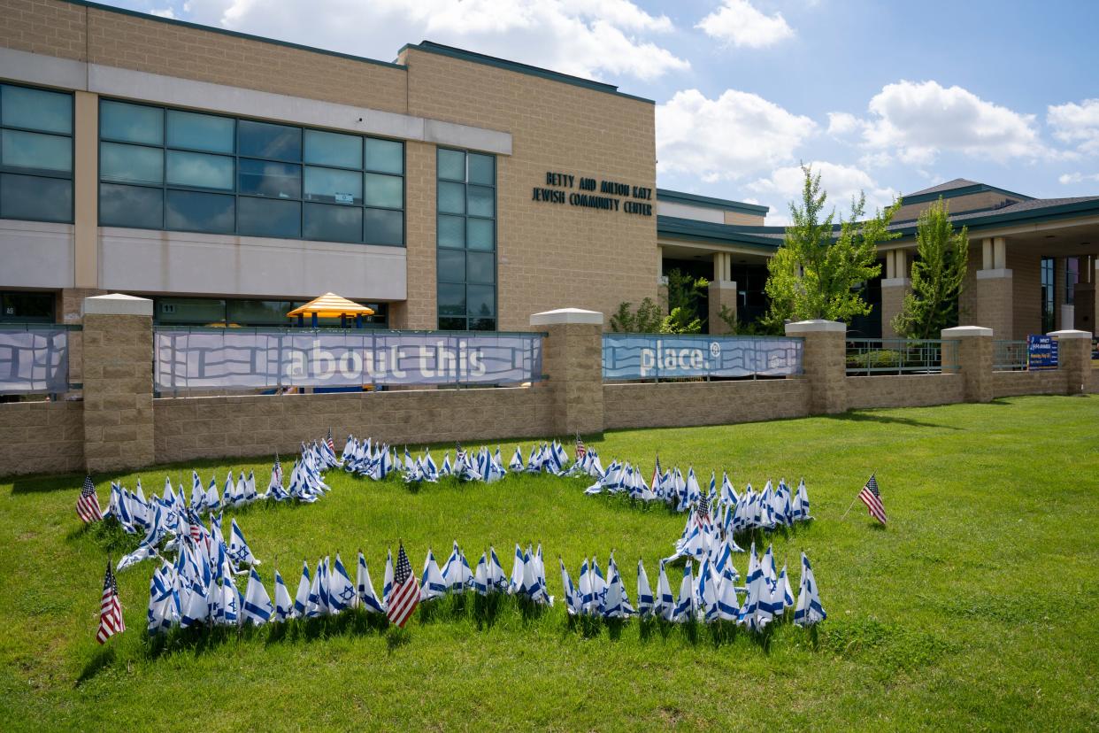 Israeli flags form a Star of David in the lawn at the Jewish Community Center in Cherry Hill, N.J.