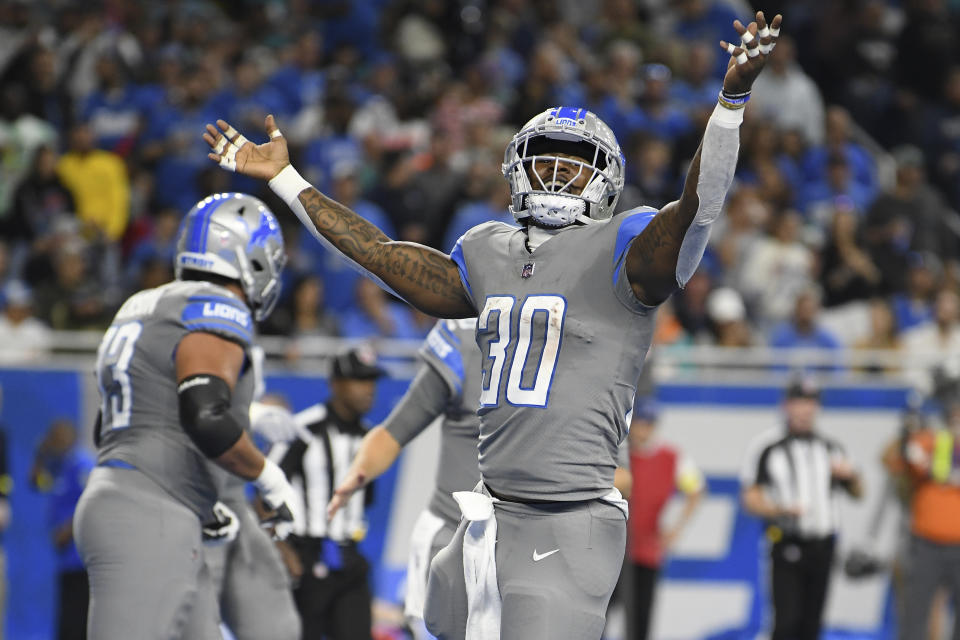 Detroit Lions running back Jamaal Williams reacts after 1-yard touchdown run during the first half of an NFL football game against the Miami Dolphins, Sunday, Oct. 30, 2022, in Detroit. (AP Photo/Lon Horwedel)