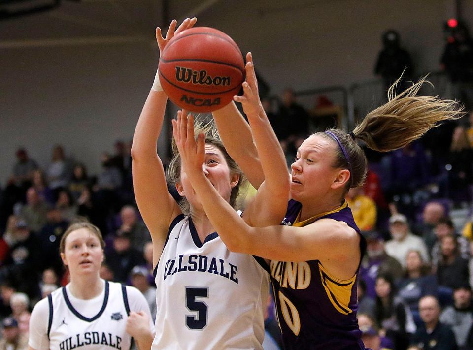 Ashland University's Hallie Heidemann (10) battles for a rebound with Hillsdale College's Sydney Mills (5) during their NCAA college women's basketball game Saturday, Feb. 26, 2022 at Kates Gymnasium. TOM E. PUSKAR/TIMES-GAZETTE.COM