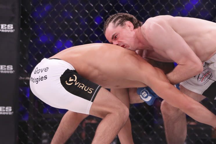 Zach Freeman (R) catches Aaron Pico in a guillotine choke in the first round of their lightweight fight Saturday at Madison Square Garden. (The Associated Press)