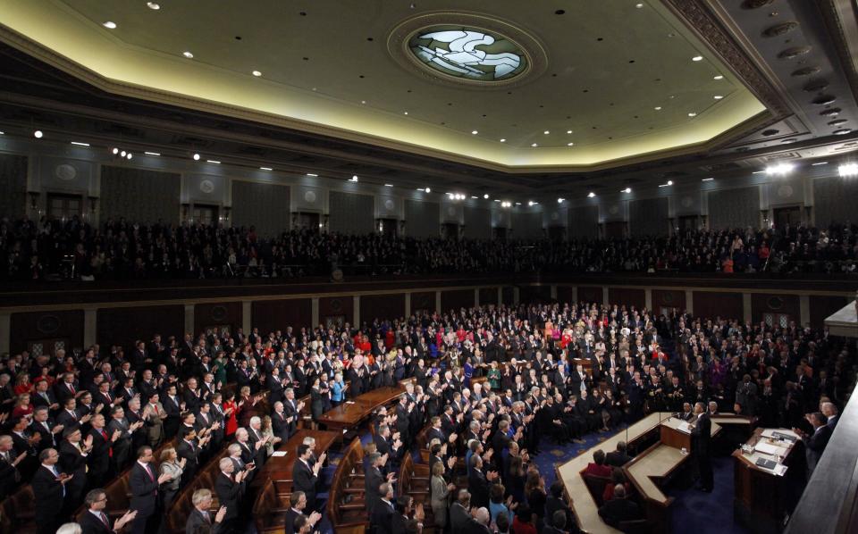 U.S. President Barack Obama receives a standing ovation as he begins to deliver his State of the Union address to a joint session of the U.S. Congress on Capitol Hill in Washington
