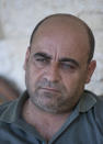 Nizar Banat, an outspoken of the Palestinian Authority, speaks to journalists at the family house, in the West Bank city of Hebron, May 4, 2021. Banat who had intended to run in parliamentary elections before they were cancelled earlier this year died during his arrest by Palestinian Authority forces early Thursday, June 24, 2021, officials said. (AP Photo/Nasser Nasser)