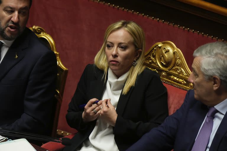 Deputy Premiers, Foreign Minister Antonio Tajani, right, and Minister of Infrastructures Metteo Salvini sit beside Italian Premier Giorgia Meloni at the Senate ahead of a confidence vote for the new Government, in Rome, Wednesday, Oct. 26, 2022. (AP Photo/Andrew Medichini)