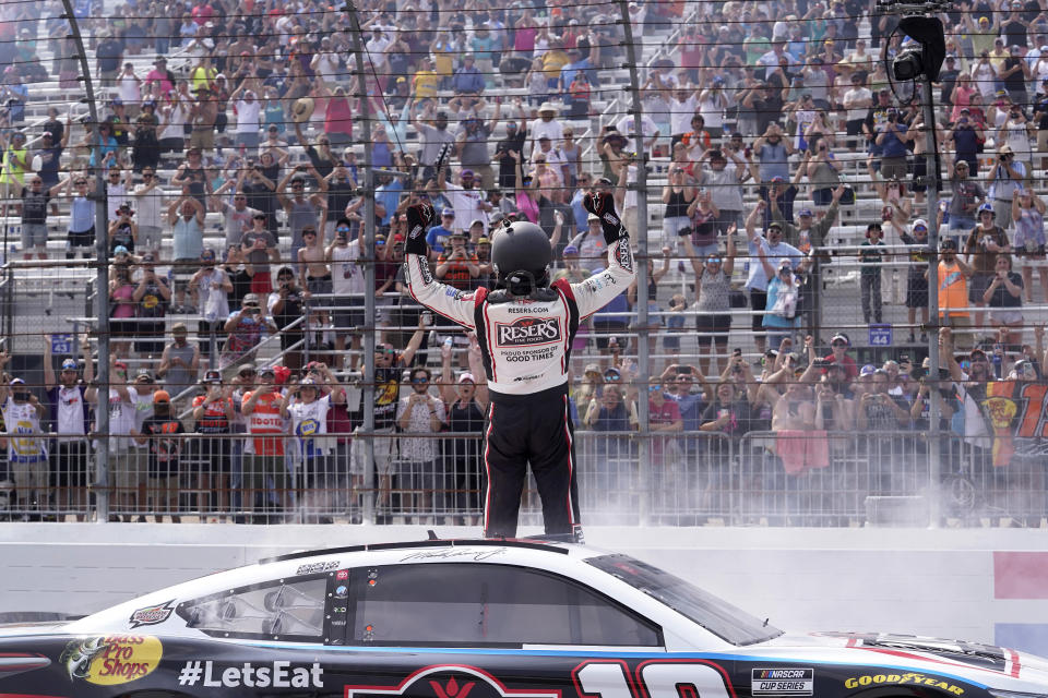 Martin Truex Jr., celebrates after winning the Crayon 301 NASCAR Cup Series race, Monday, July 17, 2023, at New Hampshire Motor Speedway, in Loudon, N.H. (AP Photo/Steven Senne)
