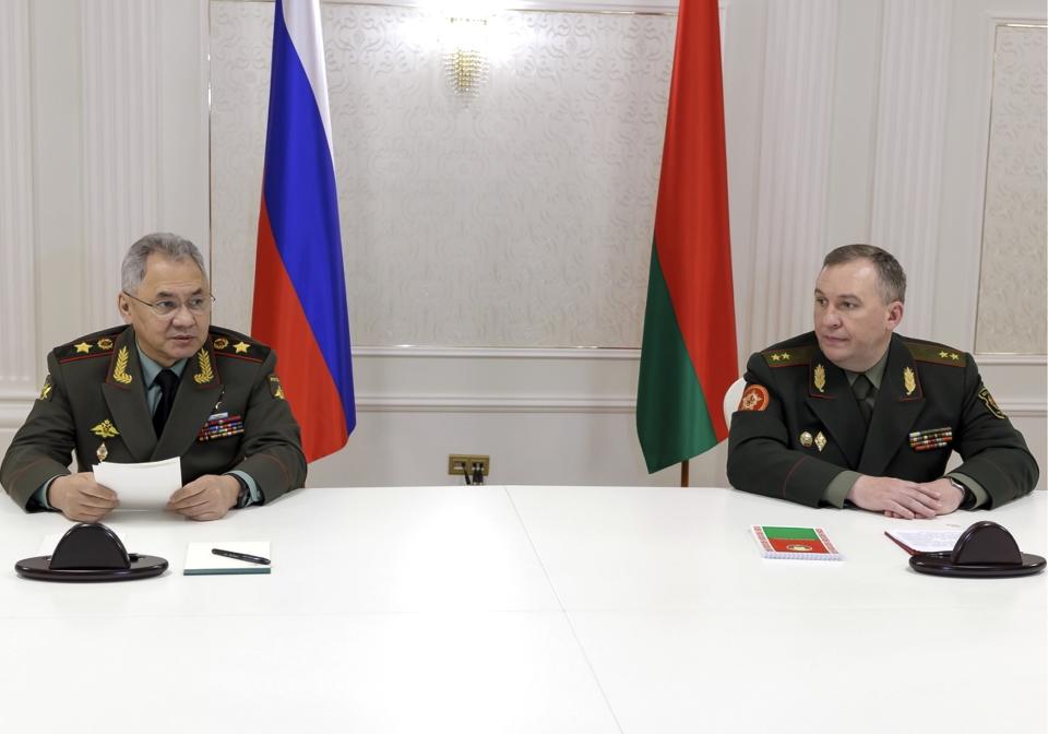 Russian Defense Minister Sergei Shoigu, left, and Belarusian Defense Minister Viktor Khrenin speak to the media after a session of the Council of Defense Ministers of the Collective Security Treaty Organization (CSTO) in Minsk, Belarus, Thursday, May 25, 2023. (Vadim Savitsky/Russian Defense Ministry Press Service via AP)