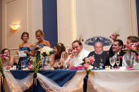 Dad stands out in a sombrero at the head table.