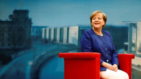 FILE PHOTO: German Chancellor Angela Merkel arrives for a TV interview by ARD public broadcaster in Berlin, Germany July 16, 2017. REUTERS/Hannibal Hanschke/File Photo