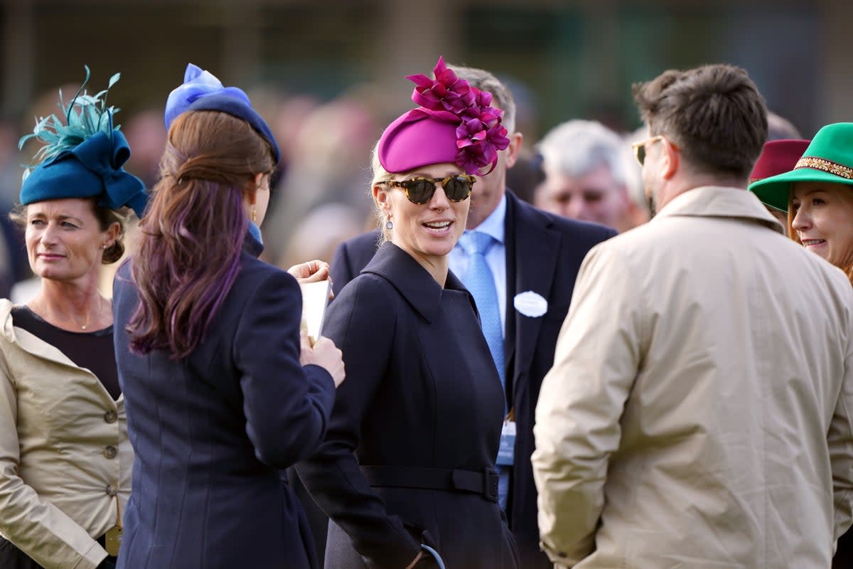 Race-day style: Zara Tindall often opts for an eye-catching headpiece – but that’s not essential  (PA)