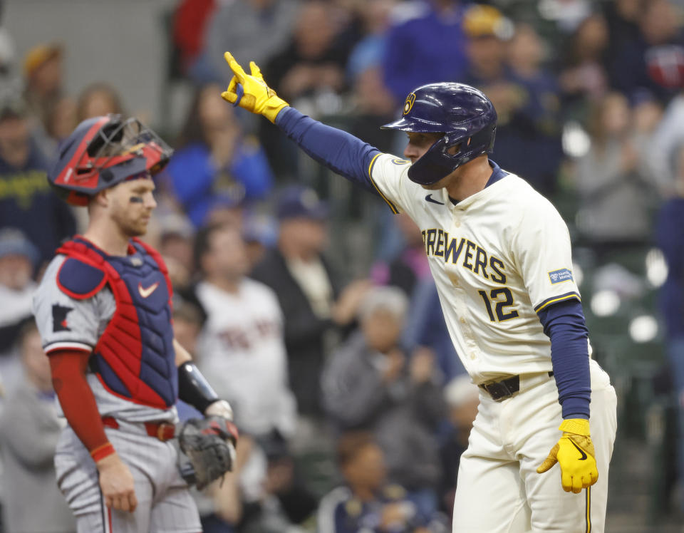 Milwaukee Brewers' Rhys Hoskins reacts after hitting a home run during the fourth inning of a baseball game against the Minnesota Twins, Wednesday, April 3, 2024, in Milwaukee. (AP Photo/Jeffrey Phelps)