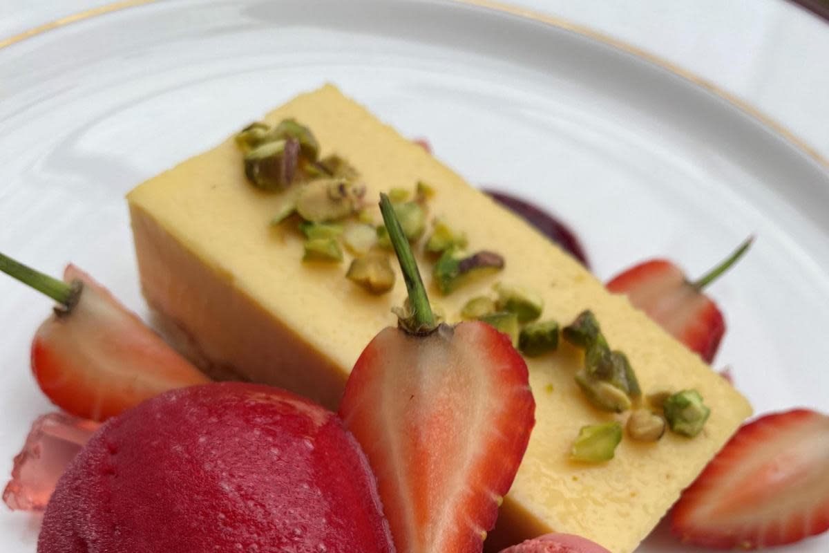 Egg custard tart with strawberry rum cocktail jelly, mixed berry sauce, pistachios, raspberry sorbet, macaroon, fresh strawberry <i>(Image: Polly Guy)</i>