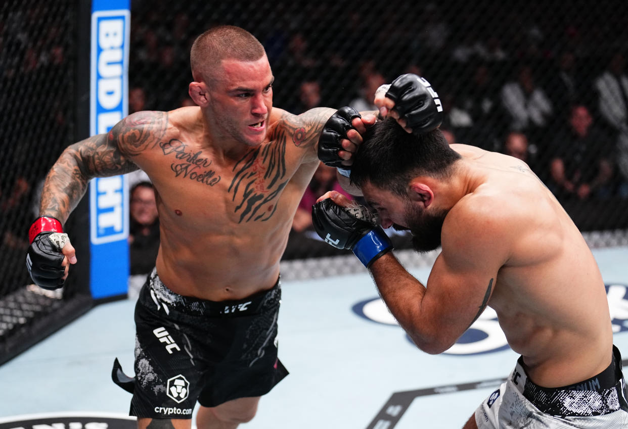 MIAMI, FLORIDA - MARCH 09: (L-R) Dustin Poirier punches Benoit Saint Denis of France in a lightweight fight during the UFC 299 event at Kaseya Center on March 09, 2024 in Miami, Florida. (Photo by Chris Unger/Zuffa LLC via Getty Images)