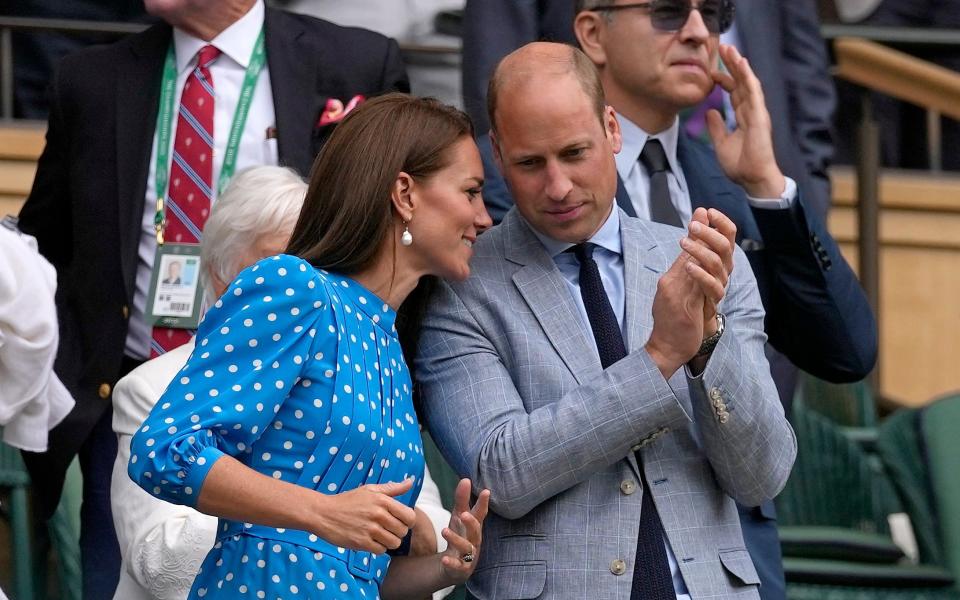 Britain's Prince William and Kate, Duchess of Cambridge applaud after watching the men's singles quarterfinal match between Serbia's Novak Djokovic - AP Photo/Alastair Grant