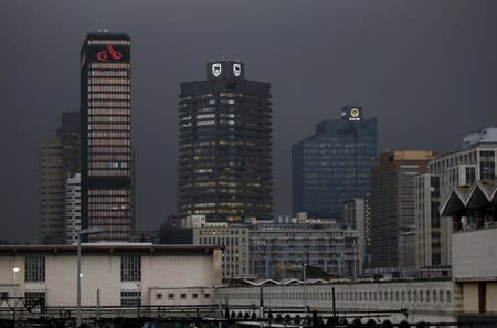 The logos of South Africa's three biggest banks, ABSA, Standard Bank and First National Bank, adorn buildings as winter storms hit Cape Town