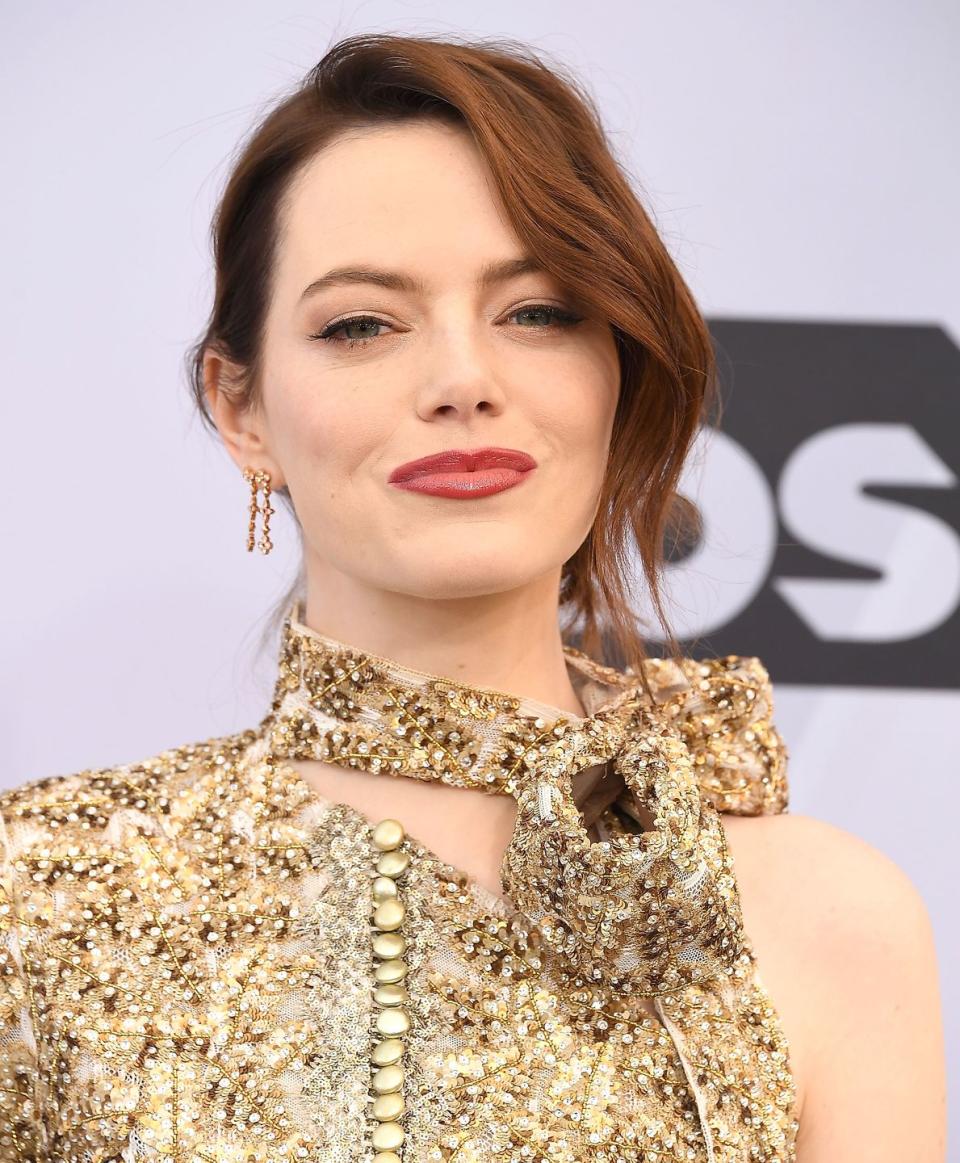 <p>We'll see a lot of deep reds—like Emma Stone's signature look—that mimic the colors of autumn, says Rivera. Think sophisticated deep brunettes mixed with auburn overtones that provide plenty of depth. </p>