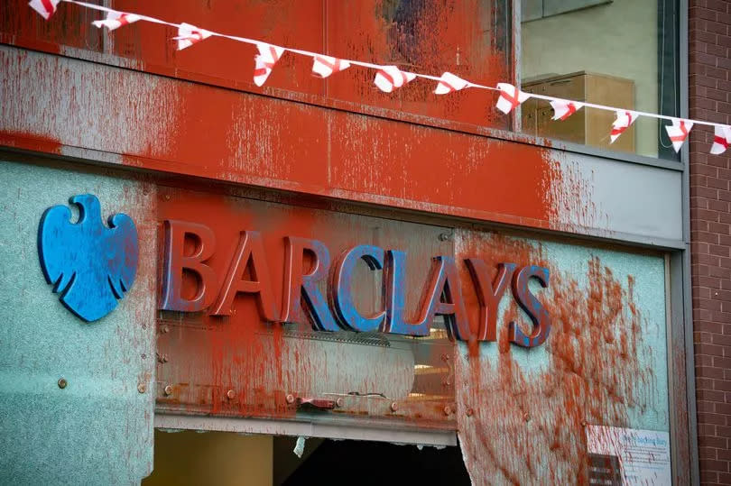 Barclays logo covered in red paint