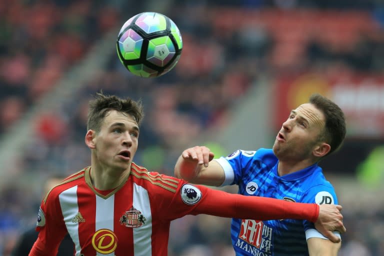 Sunderland's Donald Love (L) and Bournemouth's Marc Pugh (R) vie for the ball during their English Premier League football match at the Stadium of Light in Sunderland, north-east England on April 29, 2017