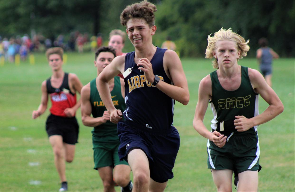 Airport's Adrian Dawes leads a pack at the 40th annual Erie Mason Relays.